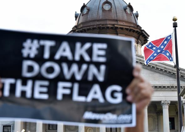 477933854-hundreds-of-people-protest-against-the-confederate-flag.jpg.CROP.promo-mediumlarge